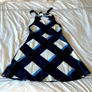 Fun and flirty summer dress with two straps, high front and mid back.